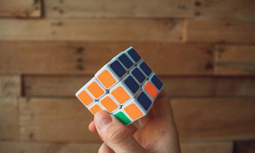 rubix cube person holding 3x3 Rubik's Cube game